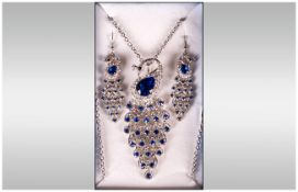 Blue and White Crystal 'Peacock' Necklace and Earrings Set,  comprising a stylised peacock pendant