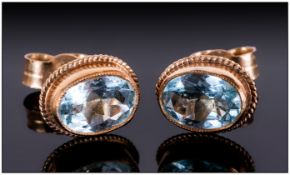 A Vintage Pair of 9ct Gold Set and Aquamarine Earrings. Marked 9ct. Boxed.