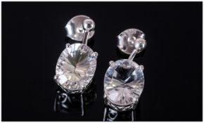 Natural Clear Rock Crystal Drop Earrings, 4cts in two oval cut stones, with concave faceting