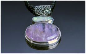 Amethyst, White Keshi Pearl and Black Agate Necklace, a large cabochon amethyst below a white