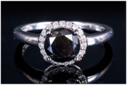 A Ladies Modern Single Stone Black Diamond Ring set in silver with white diamond shoulders.