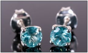 Pair of Paraibe Apatite Stud Earrings, round cuts of 1.15cts of the unusual bright blue gem,