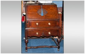 Fall Front Carved Oak Bureau, two graduated drawers and fitted interior with shaped cross