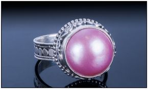 Pink Fresh Water Mabe Pearl Ring, the 14mm solitaire pearl which has developed with a flat underside