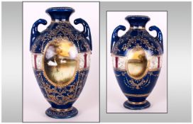 Noritake Style Hand Painted Two Handle Urn Shaped Vase, with Scenic Panels. c.1900. Stands 8.25