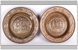 Pair of Continental Brass Chargers, embossed to the centre one with a central scene depicting a