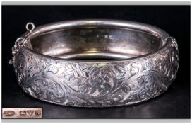 Ladies Silver Hinged Bracelet with engraved floral decoration. Hallmarked Chester 1948, 45.5 grams.