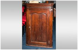 Georgian Oak Corner Cupboard With a Shaped Panelled Door. With Shaped Interior Shelves.