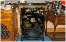 Black Lacquered Floral Decorated Cabinet, decorated in the traditional style with bird and floral