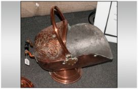 Victorian Copper Helmet Coal Scuttle embossed with floral decoration with a hoop carrying handle.