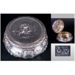 Victorian Ornate Silver Hinged Lidded Powder Bowl the cover decorated with raised images of Cherubs.