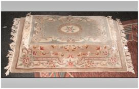 Two Modern Wool Rugs, Chinese sculptured with a floral decoration, in pastel blues and pinks.