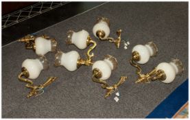 Two Double Wall Lights. Together with 4 single wall lights. Gilt with frosted glass shades.