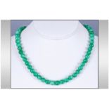 Green Jadeite Stone Bead Necklace, overall uniform colour. 17'' in length white metal clasp.