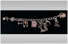 A Vintage Silver Charm Bracelet loaded with 10 charms. Fully hallmarked. 46.6 grams.