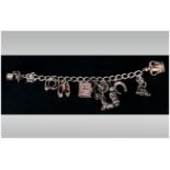 A Vintage Silver Charm Bracelet loaded with 10 charms. Fully hallmarked. 46.6 grams.