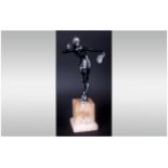 Art Deco Figure Of A Dancing Girl Holding A Silvered Fan Raised On A Square Alabaster Base. c1930's.