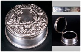 An Embossed Silver Circular Lidded Trinket Box Hallmarked Birmingham 1961. The cover in high