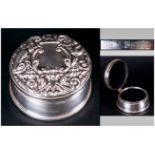 An Embossed Silver Circular Lidded Trinket Box Hallmarked Birmingham 1961. The cover in high