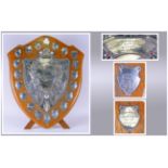 A Very Large Vintage Oak Shield Shaped Trophy with a central silver plated embossed plaque with