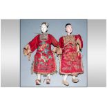 Pair of Chinese Wood and Gesso Dolls, lady and gentleman of wealth; each with roughly carved