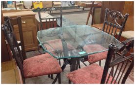 Glass Topped Table and Four Metal Chairs.