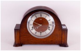 1930's Oak Westminster Chime Napoleon Hat Mantle Clock, with a round steel chapter dial. 10 inches