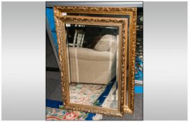 Two Gilt Framed Mirrors with bevelled glass. Overall sizes 24 by 36 and 28 by 39 inches.