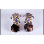 Tiffany Stone and Tanzanite Pair of Drop Earrings, a round cut cabochon of the rare, opaque gem,