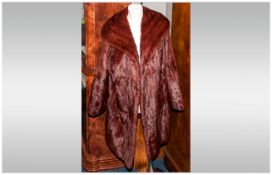 Ladies Three Quarter Length Ermine Coat fully lined. Collar with revers. Slit pockets. Approximate