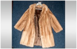 Ladies Three Quarter Length Blonde Mink Coat, fully lined. Collar with revers. Slit pockets.