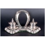 A Vintage And Impressive Silver Plated Desk Twin Ink Well Stand with a horse shoe to central