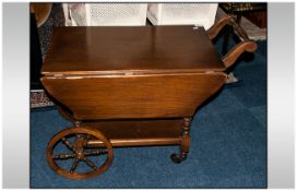 Reproduction Oak Tea Trolley on Wagon Wheels with fold down flaps. 26 inches high and 30 inches