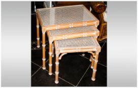 Modern Nest Of Tables in bleached wood with lattice work decoration.