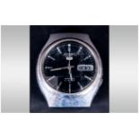 Seiko Gents Automatic Wristwatch, black dial, silvered battons and hands, with day date aperture,