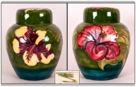 Moorcroft Lidded Ginger Jar ' Hibiscus ' Design on Green Ground. 6 Inches High. Excellent Condition.