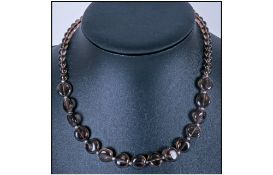 Smoky Quartz Beaded Necklace, the front section comprising smooth, clear, round, smoky quartz coin