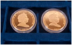 Two Commemorative One Dollar Cook Island Coins in original case. Both 2011