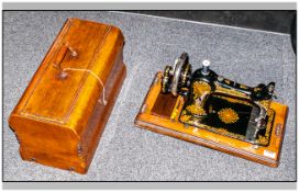 'Jones' Table Top Sewing Machine with case and carry handle.