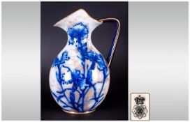 Doulton Burslem Small Ewer, decorated with transfer printed blue carnations highlighted with sponged