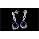 Amethyst Infinity Loop Drop Earrings, each earring having a pear cut, 1.25ct purple amethyst of good