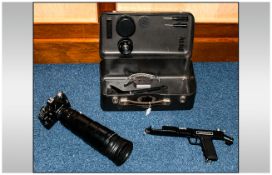 A Zenit 12S Camera and Long Range Lens in metal fitted box. Complete with extra lenses and