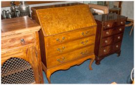 Reproduction Queen Anne Style Bureau in burr walnut. With a fitted interior and fall down front.