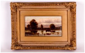 A Small Oil Painting on Panel of Cattle in a River Landscape. signed W G Fitzsimmons. Dated 1882. In