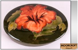 Moorcroft Oval Shaped Lidded Trinket Box ' Coral Hibiscus ' Design on Green Ground. 5 Inches