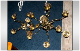 Two Brass Ceiling Light Fittings comprising one five branch chandelier and one 9 branch chandelier.