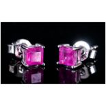 Ruby Pair of Stud Earrings, square cut rubies of 1.25cts set in rhodium vermeil and silver, with