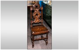 A German Black Forest Style Carved Oak Hall Chair with intricately carved back on barley twist