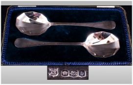 A Cased Set Of Good Quality Pair Of Silver Fruit Serving Spoons with fluted bowls. Hallmark