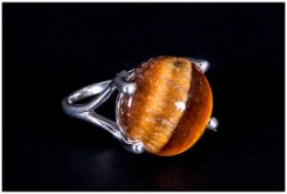 Tiger Eye Solitaire Ring, a 9.75ct round cut cabochon tiger eye, with a good display of the golden